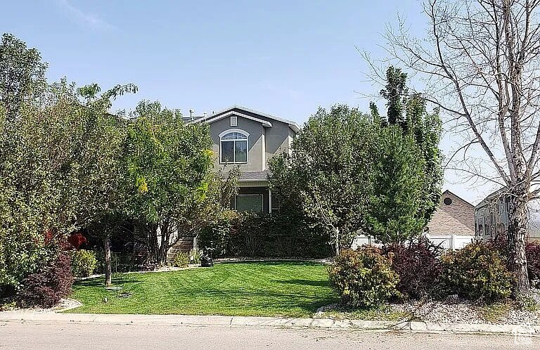 Don't miss this spacious 5 bedroom, 4.5 bathroom home offering over 4,000 sq ft of beautifully finished living space on a .33-acre lot in Vernal. Designed for both comfort and entertaining, this property features a private backyard oasis complete with a sparkling pool, perfect for summer gatherings. Inside, enjoy generous room sizes, multiple living areas, and a thoughtful layout ideal for families or guests. With over 4,000 sqft and 4.5 baths, everyone has their space. This is a rare find-schedule your showing today!
