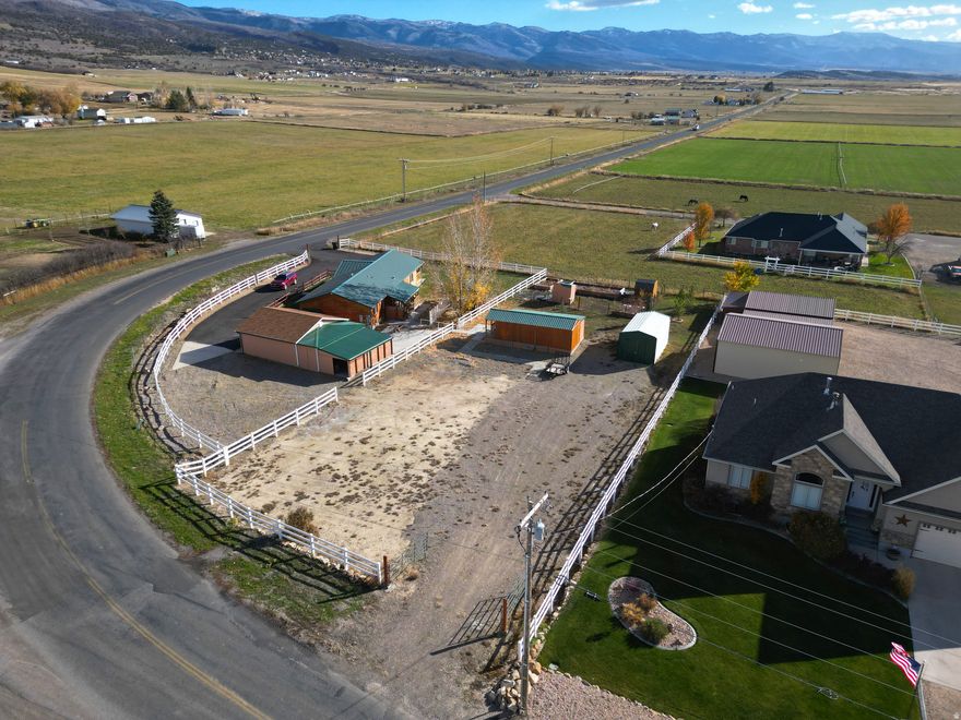 Discover this beautiful .60-acre parcel located in the heart of Fairview, just 50 minutes from Spanish Fork and nestled beneath the picturesque, Manti-La Sal National Forest. An outdoor paradise offering endless opportunities for camping, hiking, ATV riding, fishing, skiing and snowmobiling. This property includes one Class-A irrigation share with Cottonwood Gooseberry Irrigation Company, ensuring water for your garden and landscaping needs. Enjoy the convenience of an enclosed carport, two storage sheds, and a charming "she shed" with an attached "he shed"; measuring approximately 12'x32' (about 384 sq ft). Currently set up as a partial art studio and partial workshop, each side is equipped with electricity and heat. A large separately enclosed garden area provides space for self-sufficiency and outdoor enjoyment. With ample room to build your dream home and stunning mountain views in every direction, this property provides an excellent opportunity to build your dream home in a peaceful, small-town setting, surrounded by rural charm and mountain beauty. Any and all boundary lines are shown as approximate. Any and all notes regarding measurements and sqft are also approximate.  All information within is provided as a courtesy only.  Buyer and Buyer's agent are advised to complete their own due diligence and independent measurements.