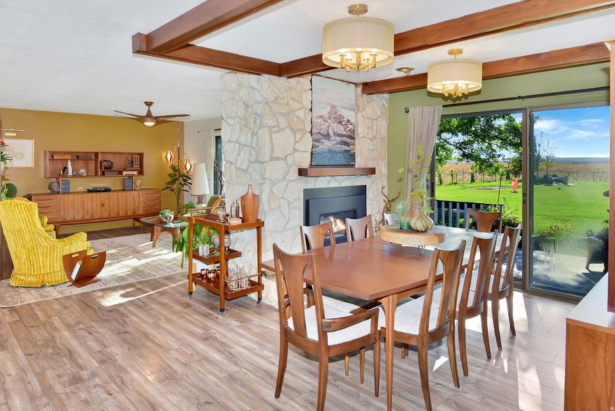 A mid-century modern dream, this classic ranch style home is a must see. Nestled in beautiful Downey, Idaho, this home sits on over 13 acres with 360 degrees of amazing views. Featuring a white washed brick exterior, when walking to the front door you will be welcomed by double entry doors and a covered porch. Entering through the front door, you'll find a spacious, open floor plan with large picture windows. The home also features a double fire place between the kitchen and dining room providing ambiance for entertaining or a quiet evening at home. The updated kitchen is complete with quartz countertops, tiled backsplash, and stainless steel appliances. Just down the hall from the kitchen sits the pantry, laundry room, and bathroom. Spacious master bedroom with walk-in closet and master bathroom. Venture to the basement into the large family room where you can enjoy comfy evenings with the wood burning stove. Three additional bedrooms and a bathroom can be found downstairs. The basement also features a large cold storage area. The exterior of this home is just as amazing as the inside with the open deck, fully fenced yard, and beautiful landscaping. Love gardening? You'll enjoy the eight raised garden beds with commercial grade weed barrier for low maintenance. Outside you'll also find a 30'x48' shop. Don't miss the opportunity to own this amazing home.