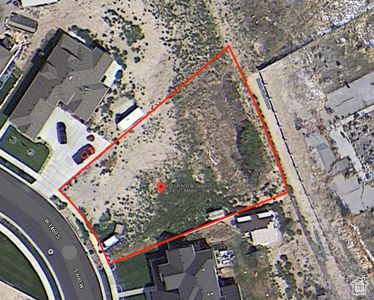 Relatively flat lot just under 1/2 acre. Prepped with Utilities. Great neighborhood, and low car traffic.