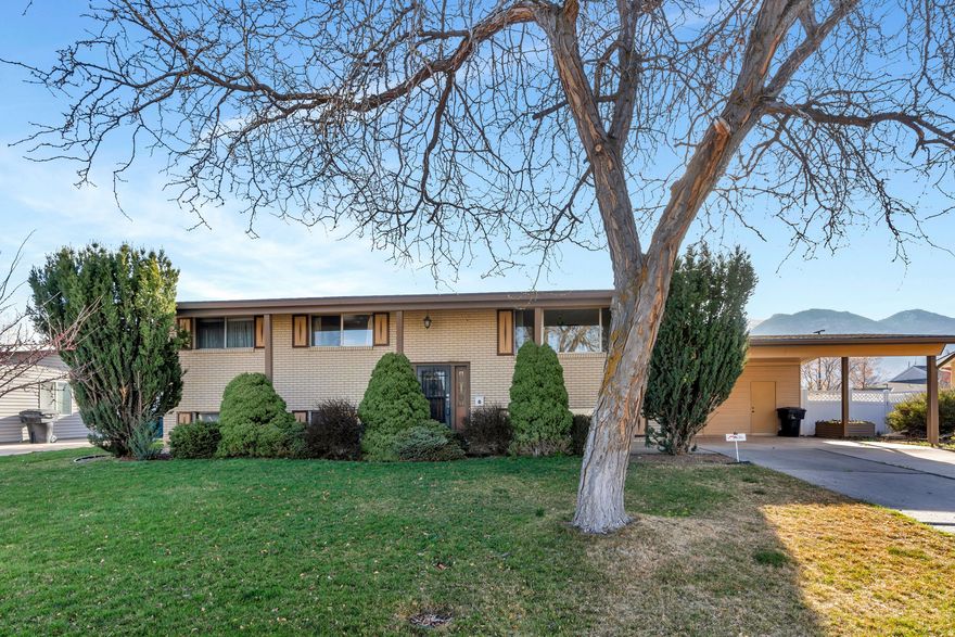 Welcome to this well-loved, one-owner home in a highly desirable Orem neighborhood! Ideally located near Costco with quick access to Provo Canyon, BYU, shopping, dining, and entertainment-this home offers both convenience and outdoor adventure right at your fingertips.  Featuring 5 bedrooms and 3 bathrooms, this spacious home includes a bright and open main level with a large living room, generous kitchen, and dining area-perfect for gathering and everyday living. The basement entry layout offers a second family room with a cozy gas stove and provides excellent potential for a future kitchen or mother-in-law apartment.  Step outside to a big, fully fenced backyard with beautiful mountain views-ideal for relaxing, entertaining, or creating your dream outdoor space.  With solid bones and room to make it your own, this home is ready for your personal touch. A rare opportunity in a fantastic location!