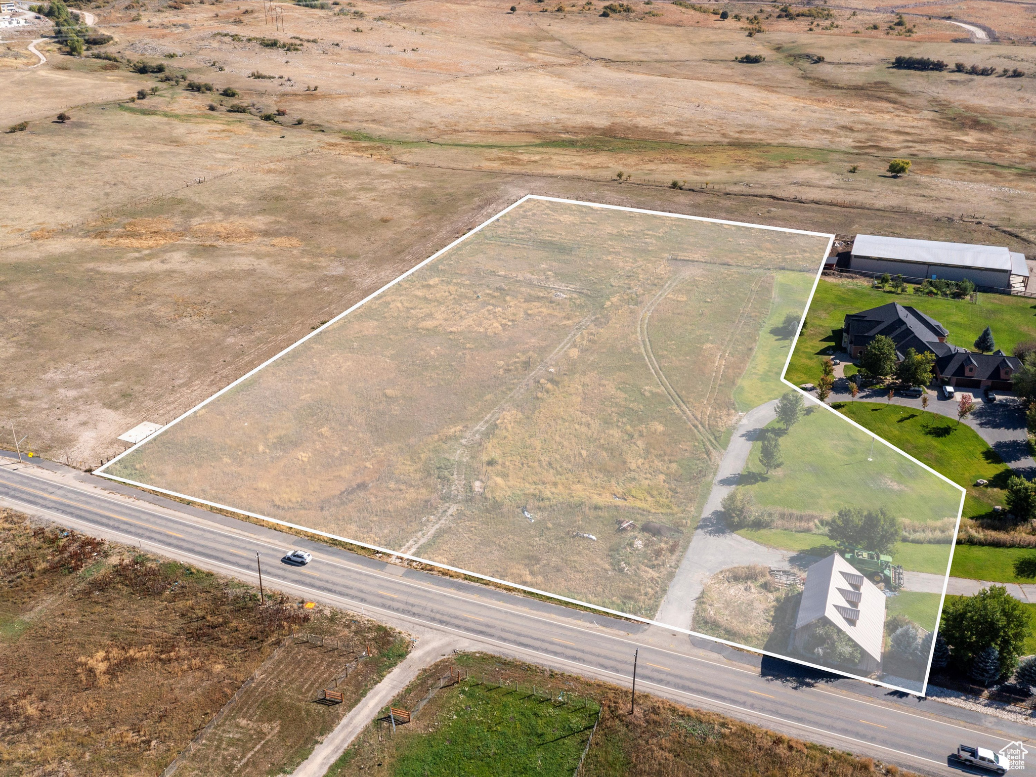 Your Large Parcel Escape in the Heart of Eden. Discover just under 7 acres of flat, usable land perfectly situated in the center of Eden. With 7 irrigation water shares from Wolf Creek and an existing barn on the property, this rare opportunity provides both space and resources to bring your vision to life, whether that's creating a private mountain estate, hobby farm, or subdividing potential. A flat, expansive parcel with water, barn, and such a central location is a rare find in Eden. Here's your chance to secure a piece of the valley with room to grow, play, and create the lifestyle you've always envisioned. Located in the heart of Ogden Valley, you'll enjoy unmatched convenience to year-round recreation. World-class skiing is minutes away, just 6 miles to Powder Mountain, 15 miles to Snowbasin, and 3.4 miles to Nordic Valley. Summer adventures are just as close, with Pineview Reservoir's Port Ramp Marina only 3 miles away for boating, paddleboarding, and lakeside fun. Boundary lines are provided as a courtesy estimate only. Buyer is advised to obtain an independent measurement.