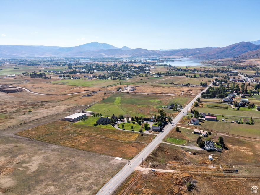 Your Large Parcel Escape in the Heart of Eden. Discover just under 7 acres of flat, usable land perfectly situated in the center of Eden. With 7 irrigation water shares from Wolf Creek and an existing barn on the property, this rare opportunity provides both space and resources to bring your vision to life, whether that's creating a private mountain estate, hobby farm, or subdividing potential. A flat, expansive parcel with water, barn, and such a central location is a rare find in Eden. Here's your chance to secure a piece of the valley with room to grow, play, and create the lifestyle you've always envisioned. Located in the heart of Ogden Valley, you'll enjoy unmatched convenience to year-round recreation. World-class skiing is minutes away, just 6 miles to Powder Mountain, 15 miles to Snowbasin, and 3.4 miles to Nordic Valley. Summer adventures are just as close, with Pineview Reservoir's Port Ramp Marina only 3 miles away for boating, paddleboarding, and lakeside fun. Boundary lines are provided as a courtesy estimate only.  Buyer is advised to obtain an independent measurement.