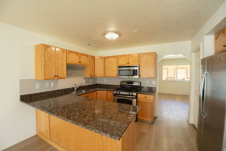 Newly renovated townhouse located in North Ogden. Brand new flooring installed throughout the entire home. Offers two spacious bedrooms, a beautiful kitchen with granite countertops, and a private garage. Conveniently located close to schools, shopping, and outdoor attractions.