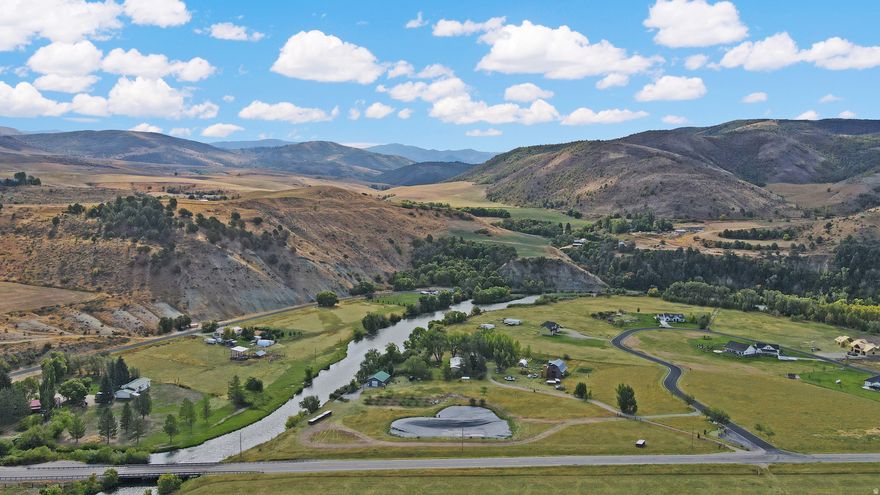 Welcome to your own slice of paradise on the river! This 4.00-acre property at 3864 E Highway 36 in Preston combines natural beauty, modern conveniences, and endless possibilities. With direct riverfront access, you can launch a kayak or tube right from your property, spend the afternoon floating the river, or simply cast a line and reel in fresh fish. Two private ponds, a mature orchard with drip irrigation, and a separate drinking well make this property as functional as it is beautiful. Solar power and sand point wells provide efficiency and sustainability, while the spacious shop gives room for storage, hobbies, or projects. The land offers the perfect canvas for your vision: build your dream home, design a private cabin retreat, host unforgettable summer gatherings, or even transform it into a wedding venue or hobby farm. Whether it's a peaceful escape, an income opportunity, or the ultimate entertaining space, this property makes it possible. Don't just buy land-create a lifestyle. For more information and shows contact Blake Ostler