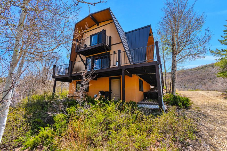Easily accessible cabin, only 5 minutes from bottom gate, and ready for move in. 3 bedrooms, 1.5 baths, and fun lower level game room with wet bar. Well maintained cabin, with newer double pane windows throughout.  Extra land behind home, down to seasonal creek.  Square footage figures are provided as a courtesy estimate only and were obtained from appraisal.  Buyer is advised to obtain an independent measurement, and to verify ALL info to buyer's own satisfaction.