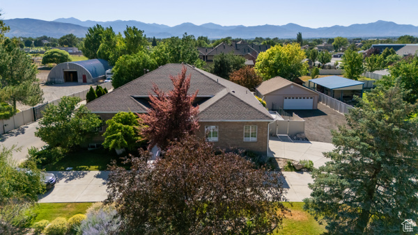 2 garages! 2 primary bedrooms; one up and one down, both w/walk-in closets! New Lamanite floors, some new carpet, granite countertops, toilets, water softener, tankless water heater, newer roof (2021) Closets by Design organizers, 2 jetted tubs, new blinds, lots of fans! Yard is incredible! pond w/waterfall, 1 covered patio and 2 uncovered. 1 includes firepit. Big newly built garage has woodshop, plenty of storage and can fit 4 cars! Vintage -looking shed adds personality to the scenic yard! Greenery of all sorts! MUST SEE! REDUCED PRICE is firm.