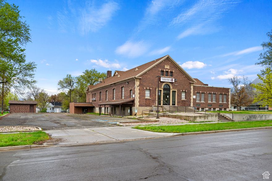 Discover this restored church building nestled across from the picturesque Monroe Park in Ogden. This unique specialty property offers exceptional versatility for your business aspirations-whether you envision a distinguished educational institution or place of worship. The property features two magnificent assembly halls, including one with impressive stadium-style sloped seating perfect for presentations or gatherings. With fourteen adaptable rooms ideal for offices or classrooms, this building provides ample space for various organizational needs. The thoughtfully designed interior includes 4 bathrooms, a functional kitchen, and separate facilities for men and women. Exterior amenities enhance this property's appeal: two spacious parking lots offer abundant parking for staff and visitors - a true luxury in this central location; and a sturdy 14' x 14' storage shed provides additional utility space for equipment or supplies. This centrally located gem places you within convenient reach of Ogden's vibrant downtown district. Just a short drive from the Ogden train station, the property benefits from excellent connectivity while maintaining a serene setting adjacent to green space. This former house of worship retains architectural charm while accommodating modern professional needs. The thoughtful renovation preserves distinctive elements while ensuring functionality for contemporary use. Seize this rare opportunity to establish your enterprise in a landmark building with history, character, and prime positioning in one of Ogden's most convenient neighborhoods. Ogden City HUBZone Certified.