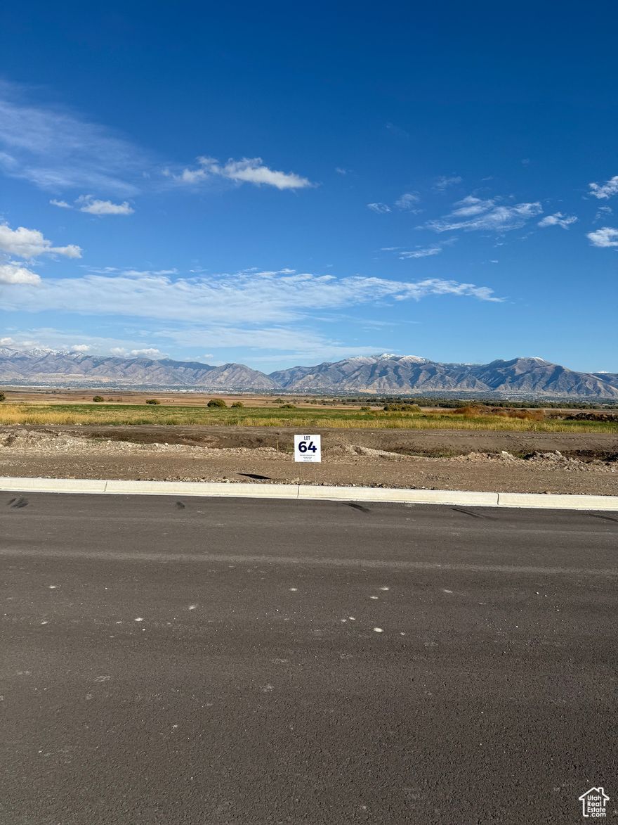 Bring your own Builder! Multiple lots available - Build your dream home in the peaceful and scenic community of Mendon. Blueberry Springs offers spacious 5/8+acre lots with breathtaking views of the mountains and valley. Enjoy paved public roads and full utility access, including Mendon City water, data, power, and secondary water stubbed to each lot. Irrigation water is managed and maintained by the Blueberry Springs HOA. Buyers are responsible for choosing and installing a septic system, subject to approval by Cache County. Each lot includes curb, gutter, and sidewalk frontage. This subdivision allows animal rights in accordance with Mendon City ordinances (https://mendoncityutah.gov). Bring your own builder and design your ideal home while adhering to city setbacks and protective covenants that maintain the neighborhood's appeal.