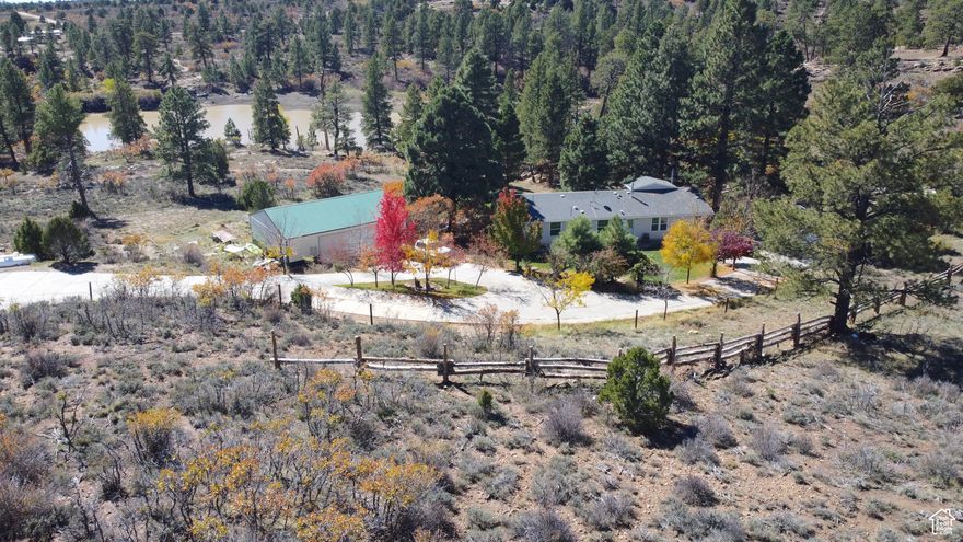 Opportunities like this don't come around often-don't miss your chance! Enjoy a private, secluded mountain setting with just the right amount of neighbors nearby, all within a short drive to Blanding or Monticello. Residents share exclusive owned access to a hidden private lake, known only to a few.  The home has been beautifully updated over the past five years, featuring a modern kitchen and great room, an inviting living area, and a spacious master suite. Outside, you'll find a landscaped yard and plenty of space to make your mountain dreams a reality. The property includes a 30' x 40' detached shop - with a finished bunk room perfect for extra guests, a "man cave," or a cozy "she shed," and an additional oversized 30' x 30' garage.