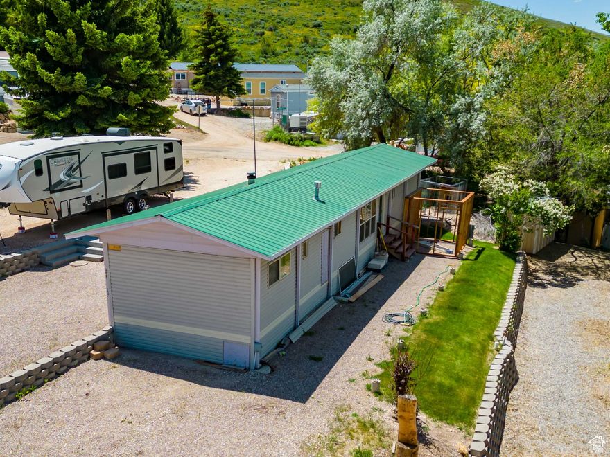 Located in beautiful Bear Lake!  Not far from public beach access!!  Extended living room for nice open gatherings, tongue and groove, tankless water heater, upgraded cabinets, landscaped yard with raspberries, pitched roof, nice gravel paring area.  Close to the community swimming pool, playground, grassy common area, basketball court and sand volleyball pit!  Buy your Bear Lake home today!  No rentals allowed in this HOA.   Square footage figures are provided as a courtesy estimate only.  Buyer is advised to obtain an independent measurement.