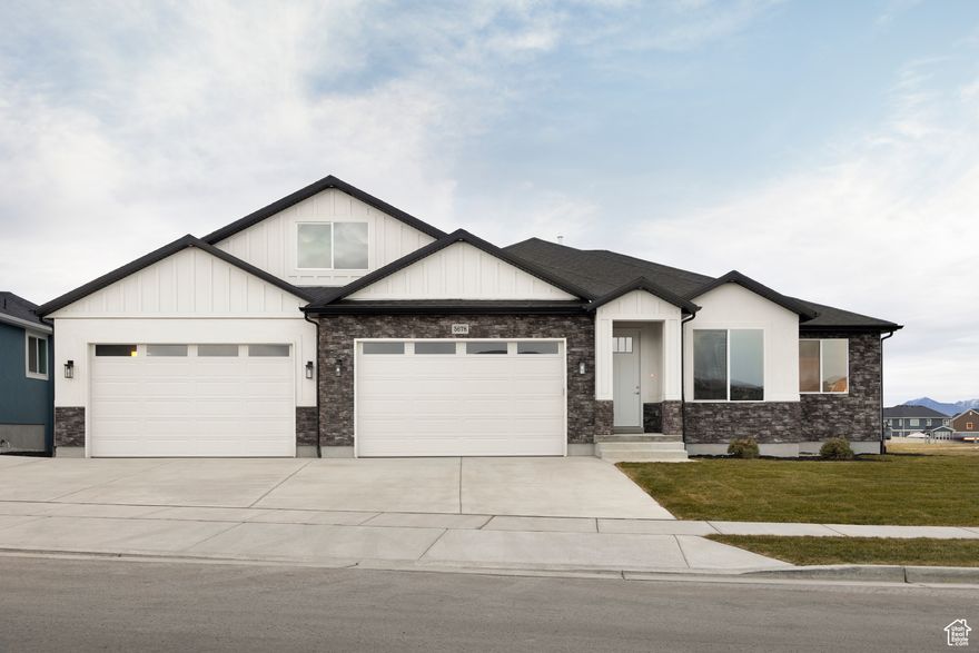 Builder Model Home for sale! Many upgraded options and features! 4-car garage with stairway to basement and bonus room which could be used as a home office space or game room! Basement apartment with grandmaster bathroom downstairs. Open floor-plan with big windows and incredible mountain views! The full daylight and walk-out basement backs onto biking trails and walk-ways. Situated in the middle of the elementary, middle and high school, this is an ideal location! Call to schedule an appointment, you won't want to miss out on this home! Buyer to verify all.
