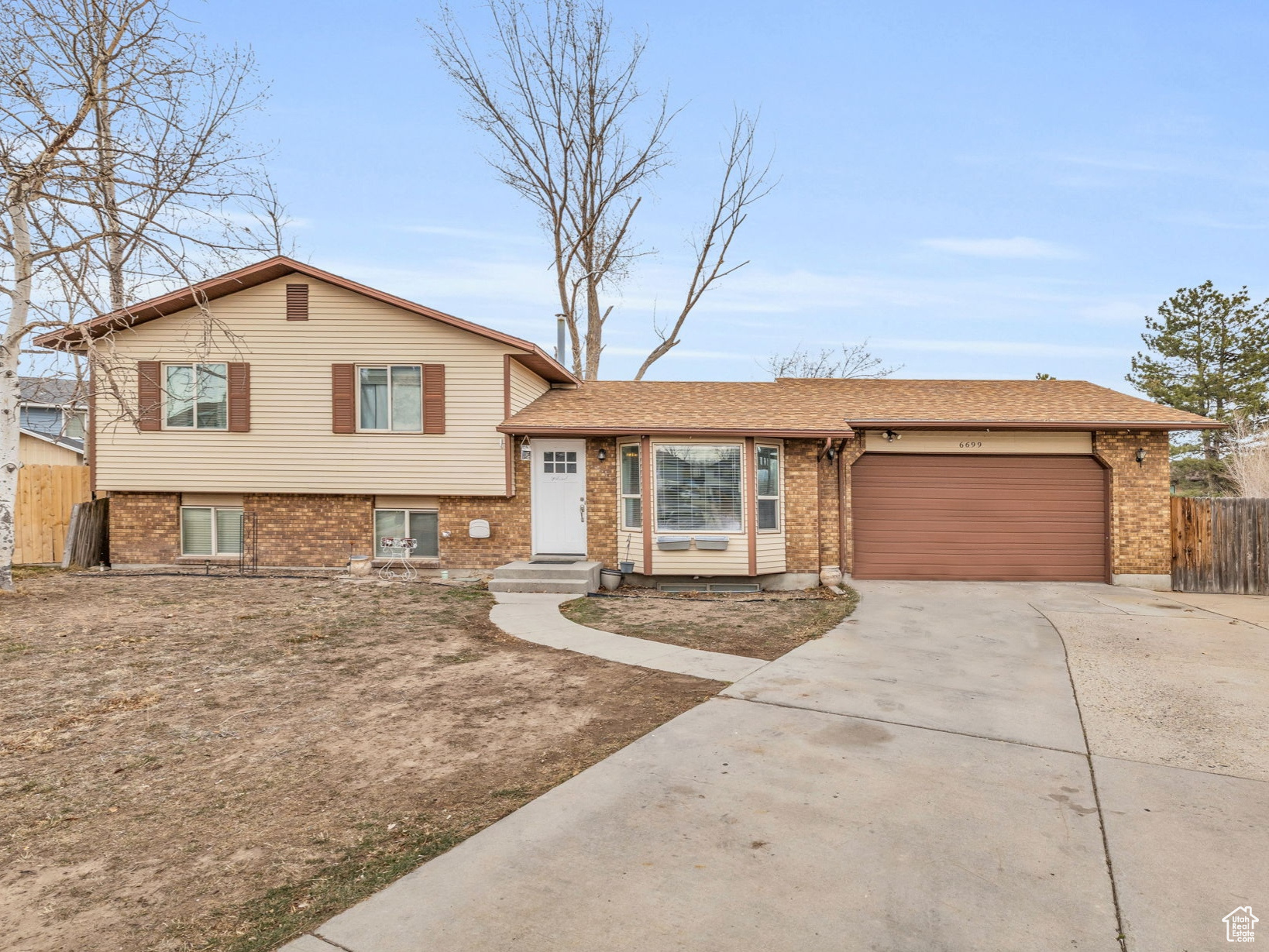 *Feb 8th Open House cancelled per seller's request. We apologize for any inconvenience* This well-maintained home in Oquirrh Shadows is move in ready. The updated kitchen boasts white cabinets, stainless steel appliances, and laminate flooring. With 6 bedrooms and 2 separate living spaces, there's plenty of room for relaxation and entertainment. Enjoy the convenience of a 2-car garage, RV parking, and an oversized driveway with ample parking. Don't miss this incredible opportunity!