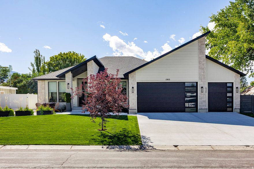 ***OPEN HOUSES - Sat Jan 17 10-12, Sun Jan 18, 11-2***Built in 2020, this beautifully designed modern rambler offers the perfect blend of luxury, comfort, and functionality. Thoughtfully laid out across 4,080 square feet, the home features 4 bedrooms, 4 bathrooms, a home gym and a 3-car garage on a .23-acre lot. The open-concept main level is filled with natural light and highlighted by vaulted ceilings, expansive living spaces, and high-end finishes throughout. The chef's kitchen flows seamlessly into the living and dining areas, creating an ideal setting for everyday living and entertaining.  Step outside to a fully equipped outdoor kitchen and entertaining space, perfect for gatherings, summer evenings, and year-round enjoyment.  The bright and spacious basement offers a large gathering area with a stylish mini-bar, ideal for hosting or relaxing, along with a separate enclosed "toy" or flex room-perfect for keeping games, hobbies, or kids' items neatly tucked away.  Modern, inviting, and exceptionally well-appointed, this home delivers easy single-level living with flexible spaces designed for today's lifestyle.