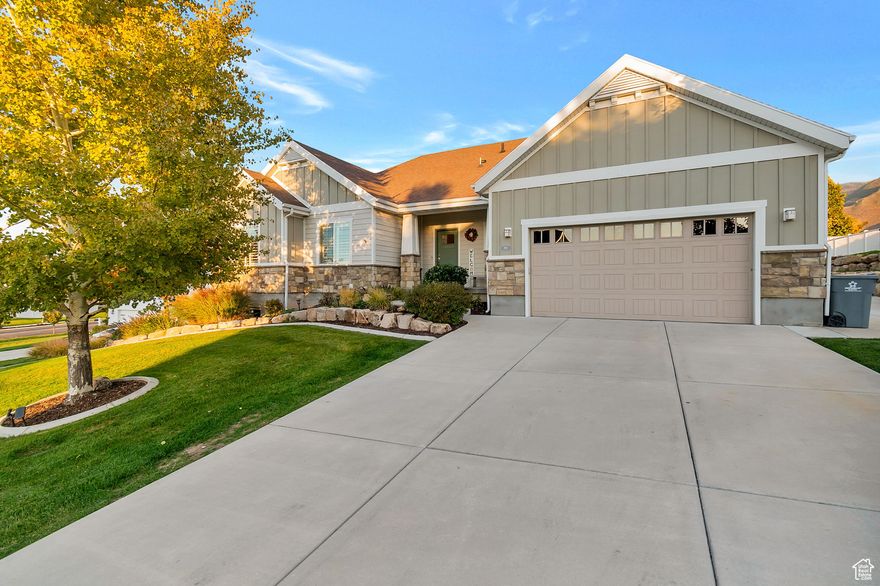 Welcome to beautiful Elk Ridge, Utah! This beautiful home in the highly sought after Traditions subdivision sits on a large .37 acre lot in a serene neighborhood. Enjoy majestic views of beautiful Mount Loafer, Utah Lake and the Utah County skyline. This spacious and well designed rambler features 9 foot ceilings on both the main and basement floors. Additional vaults on the main floor give the home a grand feel. This home is light and airy inside and features,  granite countertops, plantation shutters throughout the main floor, a gas log fireplace, full tile kitchen backsplash, gas range, double sinks in the full baths, recently upgraded carpet throughout, waterproof LVP flooring and a radon mitigation system for your family's safety. The fully landscaped yard includes a large concrete patio, a fully enclosed vegetable garden with full auto drip system and mature fruit trees ( 2 apple, 2 peach, 2 apricot and a cherry tree.) This gorgeous home is move-in ready, so don't miss out on this one!! Schedule your private showing today.