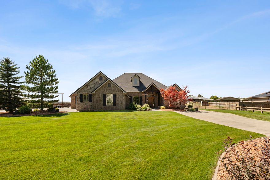 An exceptional custom residence in the prestigious Heritage Ranch community, where refined living meets elevated country elegance.  Expertly designed and built with uncompromising quality, this property offers a rare opportunity to own a truly distinguished estate.  Set on 1.25 acres, the grounds are thoughtfully curated with a premier equestrian setup including turnouts,  riding arena, multiple culinary water spigots, and custom drill pipe fencing and gates.  Two RV dumps are located on the property for those who love to travel. The professionally landscaped property also features covered RV storage/coverall 24 x 45 and an impressive 36 x 52 Cleary shop. This insulated and heated structure includes five overhead doors, three man doors, concrete floors, a finished bathroom, tack room, sitting area, and hot & cold water. 23x65 insulated Horse barn with 4 stalls and individual automatic water units. Inside, the home showcases timeless design and exceptional craftsmanship.  The expansive great room with vaulted ceilings and striking custom rock fireplace creates a warm yet sophisticated gathering space.  The private primary suite offers a luxurious retreat with a spa-like bathroom and generous closet space.  The gourmet kitchen is beautifully appointed with new granite and other alternative countertops, a large island, and custom cabinetry.  Additional features include planation shutters, custom woodwork, a dedicated office/den, bonus room above three car garage, jack& jill bathroom, title flooring, and an expansive covered patio. Constructed with 2x6 exterior framing, a 10/12 pitch roof, and high-efficient HVAC. Fully services with sewer, power, culinary water, and pressurized secondary water, 4 water shares. A property of this caliber is exceptionally rare and nearly impossible to replicate at this price point.  A true legacy property offering space, privacy, and refined county living with modern convenience.