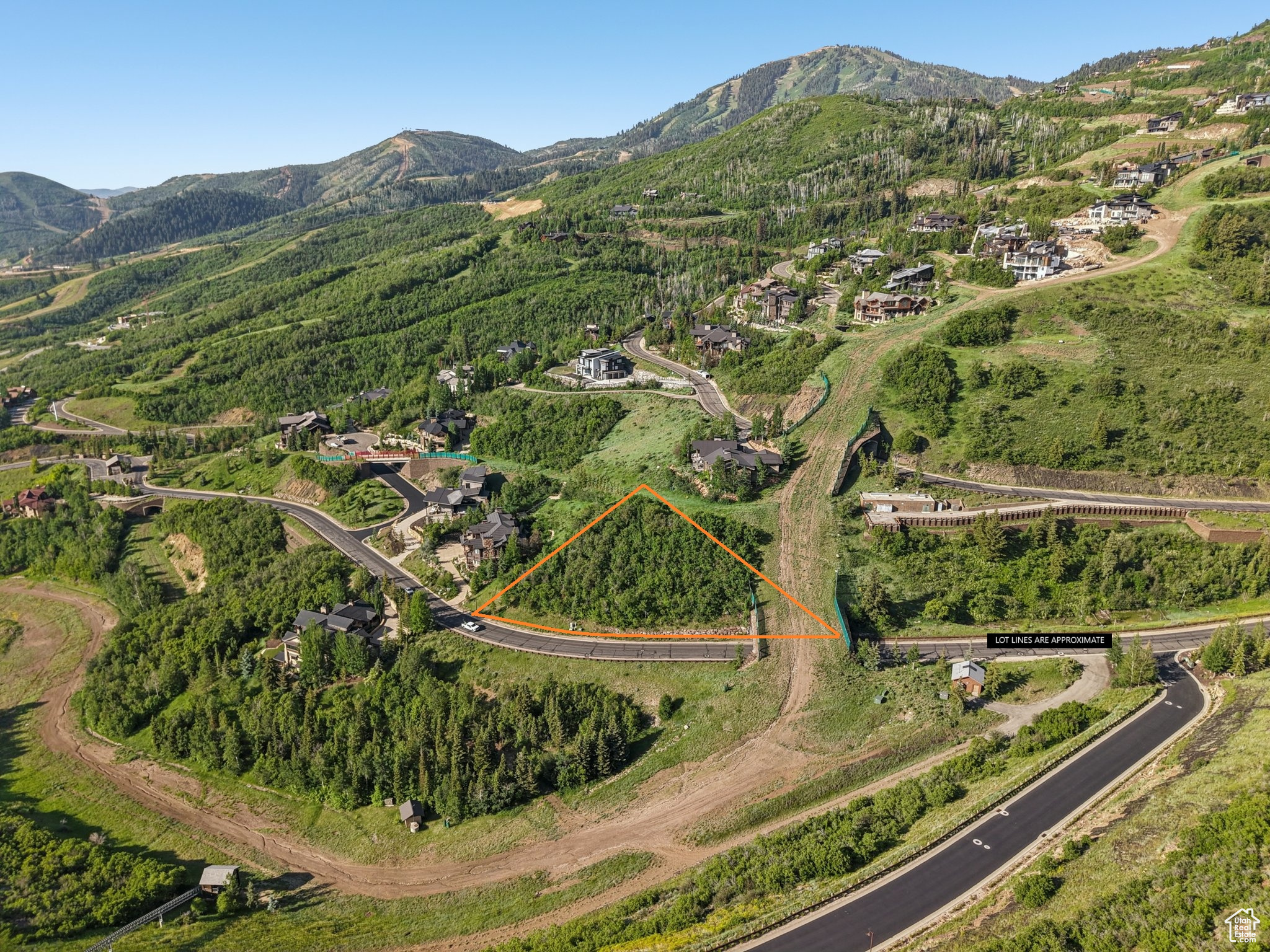 This exceptional .98-acre ski-in/ski-out homesite in Deer Valley's prestigious gated community of Deer Crest offers the perfect blend of convenience, luxury, and stunning natural beauty. Gently sloping uphill with breathtaking lake views, the lot provides an ideal setting for a custom mountain retreat. Ski access is located at the upper rear of the property, with the ski run leading directly to the Deer Crest Gondola. Offering convenient connectivity to Salt Lake City and Heber City, this property is ideally situated near the emerging East Village and Jordanelle Reservoir, providing endless year-round recreational opportunities. Deer Crest's two gated entrances-one at Snow Park Village and the other at Jordanelle-deliver the perfect balance of accessibility and privacy. This property presents a rare opportunity to build a home that embraces the very best of mountain living.