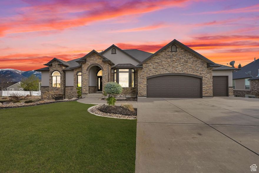 PRICED TO MOVE!!  Absolutely an amazing property! With too many features to list, this immaculate North Ogden home was built in 2005 on a .49 acre corner lot with paved and/or concrete access around the home with room to park a few toys, including an RV. This home contains two kitchens, granite countertops throughout, gorgeous primary  bed and bathroom with a walk-in closet, two gas fireplaces, theater room, exercise room, hot tub, covered deck and patio, three car garage with a car hoist, additional single car garage accessible from the backyard, underground sprinklers, 1.5 shares of Mountain View Irrigation Company water, security cameras, beautiful landscaping, gorgeous mountain and valley views. Perhaps one of the most captivating features is a mother-in-law apartment in the basement. Don't miss out on an opportunity to own one of Utah's finest properties. Buyer and Buyers Agent to verify the accuracy of all information provided including the square footage. Information is provided as a courtesy only. Please allow for a minimum of 24-48 hours notice for all showings, as the basement currently has a tenant.