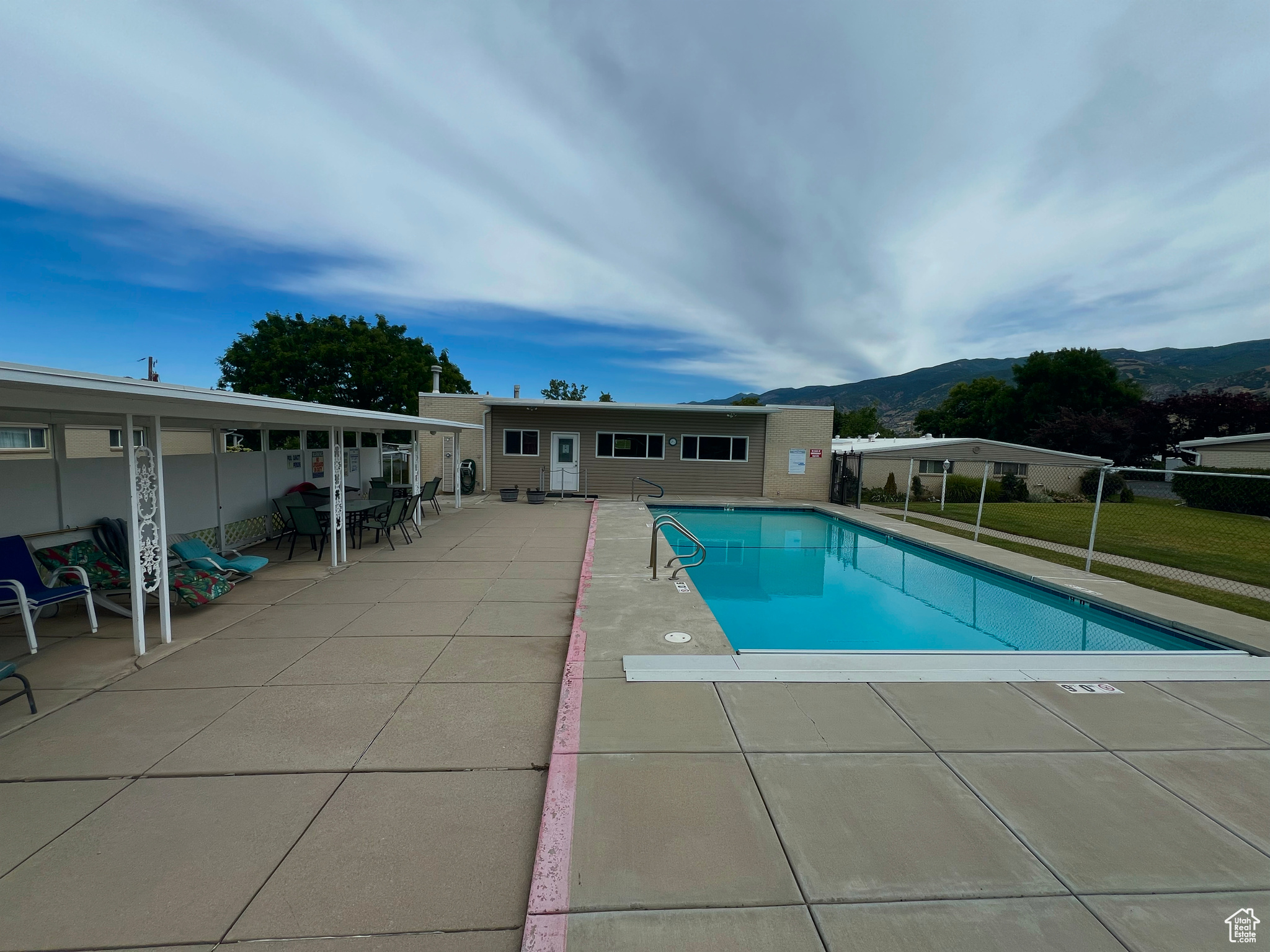 This rare and high-demand spacious 55+ condo in Bountiful offers comfortable and convenient single-level living, boasting more square footage than many other units in the area. Featuring ADA accessible hallways, doorways, and countertops, and no steps throughout, this unit provides accessibility for those with mobility considerations, both now and in the future. Recent updates include brand new carpeting in the living room and bedrooms, along with tilework, countertops, and rarely used appliances that were all new approximately 10 years ago. Enjoy relaxing views of the nearby park and Wasatch Mountains from your bedroom window and the cozy ambiance of a working brick fireplace in the living room. The condo also features a large, in-unit storage room for easy access to belongings, and a second bedroom with its own entrance, perfect for a caregiver or visiting family. Natural daylight floods the unit through two skylights, creating a bright and cheerful atmosphere. Located in a quiet community with good neighbors and walking paths, this unit is also conveniently situated near its two covered parking spaces, the swimming pool, and essential amenities like a grocery store, restaurants, the post office, and Downtown Bountiful. As a bonus, the seller is offering a 1-year home warranty with the purchase. Buyer to verify all.