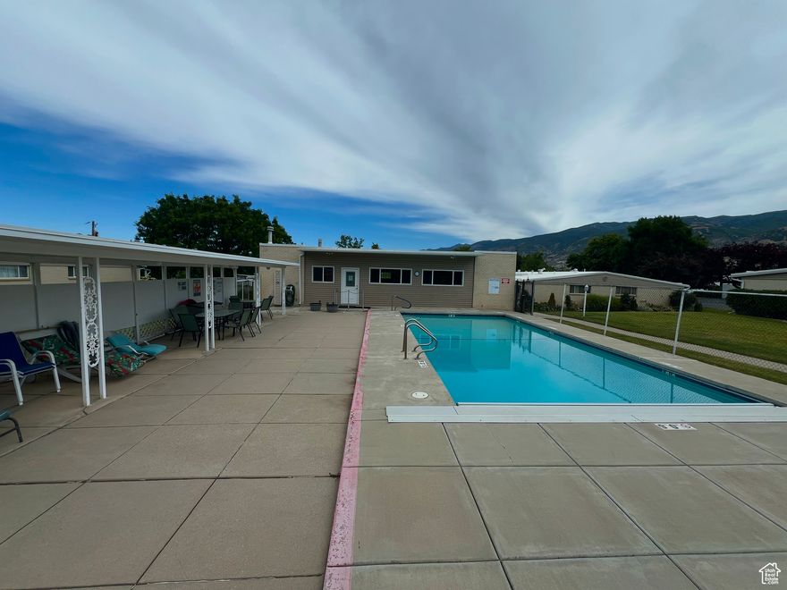 This rare and high-demand spacious 55+ condo in Bountiful offers comfortable and convenient single-level living, boasting more square footage than many other units in the area. Featuring ADA accessible hallways, doorways, and countertops, and no steps throughout, this unit provides accessibility for those with mobility considerations, both now and in the future. Recent updates include brand new carpeting in the living room and bedrooms, along with tilework, countertops, and rarely used appliances that were all new approximately 10 years ago. Enjoy relaxing views of the nearby park and Wasatch Mountains from your bedroom window and the cozy ambiance of a working brick fireplace in the living room. The condo also features a large, in-unit storage room for easy access to belongings, and a second bedroom with its own entrance, perfect for a caregiver or visiting family. Natural daylight floods the unit through two skylights, creating a bright and cheerful atmosphere. Located in a quiet community with good neighbors and walking paths, this unit is also conveniently situated near its two covered parking spaces, the swimming pool, and essential amenities like a grocery store, restaurants, the post office, and Downtown Bountiful. As a bonus, the seller is offering a 1-year home warranty with the purchase.  Buyer to verify all.