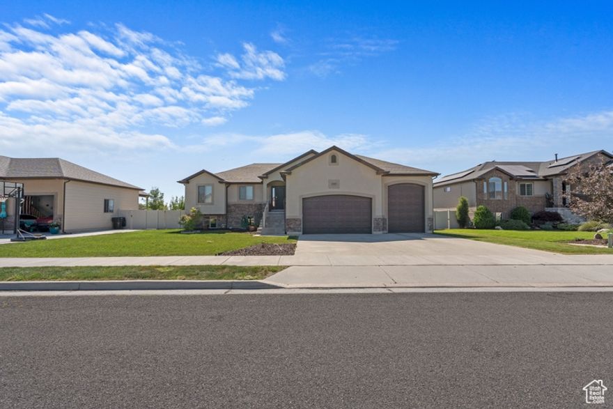 BE THE SECOND OWNER OF THIS GEM! This could be your next Price Improvement! Gorgeous home! Walk into this beautiful Open-Concept home with a great room and kitchen with granite counters, custom cabinets, and a large kitchen island. The dining area overlooks the beautiful outdoor scenery. 3 bedrooms, 2 full bathrooms, a half bath/mud room, and laundry are all on the main level. Large master bedroom with a walk-in closet. The master bathroom comes with a Jetted tub and a separate glass-encased shower. Well-designed daylight basement with a large family room and kitchenette and 2 more large bedrooms. Basement has another full bathroom with a stand alone shower.  The basement also has a massive storage room for all the extra stuff. The oversized garage is extra deep.  Lots of storage in the garage loft, and garage shelving. The backyard has a 5 x8 shed to store outdoors tools to work in your beautiful garden that is gated for privacy. Mature fruit trees and raised garden beds. No HOA! Energy efficient. Beautiful sunsets....great location with NO backyard neighbors. Just a few minutes from HAFB, Freeway access, and Shopping Centers, 35 mins from SLC and SLC Airport, Lakes, and ski resorts. Square footage figures are provided as a courtesy estimate only and were obtained from County records.  Buyer is advised to obtain an independent measurement.