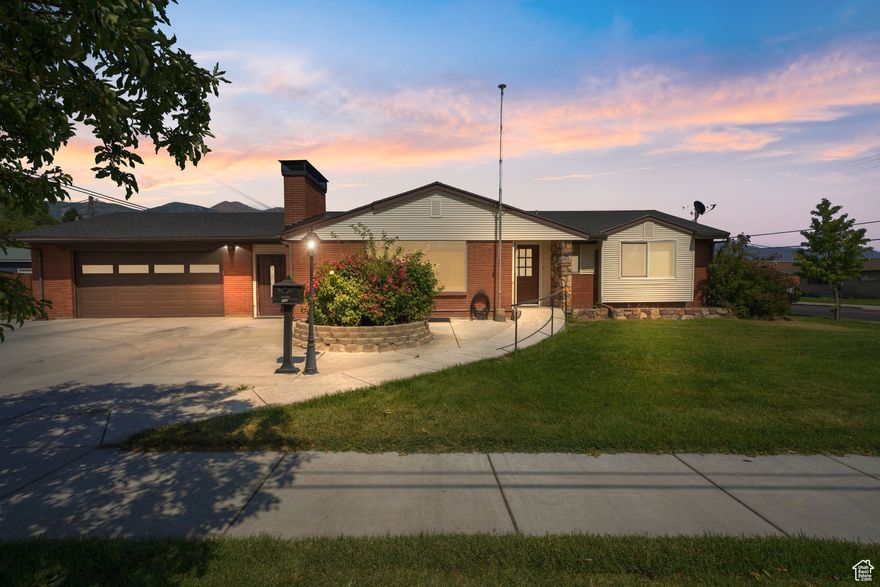 Back on the Market! Buyer's Financing fell through! Seller is Offering $15,000 in concessions towards your loan!  Proudly owned by one family since it was built, this well-maintained brick rambler offers timeless quality and ADA accessibility. Enjoy one level living with a no-step entry and new concrete out front as well as grab bars in the on suite primary bathroom.  The cozy living room features a beautiful stone fireplace. Downstairs, the fully finished basement boasts brand new carpet, and a guest room with its own entrance from the breezeway. You'll also appreciate the dedicated storage room in the extra deep garage, and plenty of space for extra freezers or a workshop. Worry a little less with a roof that is only three years old, extra insulation added throughout, and 90 gallons of hot water between two water heaters. Located in a quiet, established neighborhood, just a couple of minutes from plenty of shopping and both American Fork freeway exits, and just a block from the elementary school, this home combines comfort, functionality, and truly an unbeatable location!