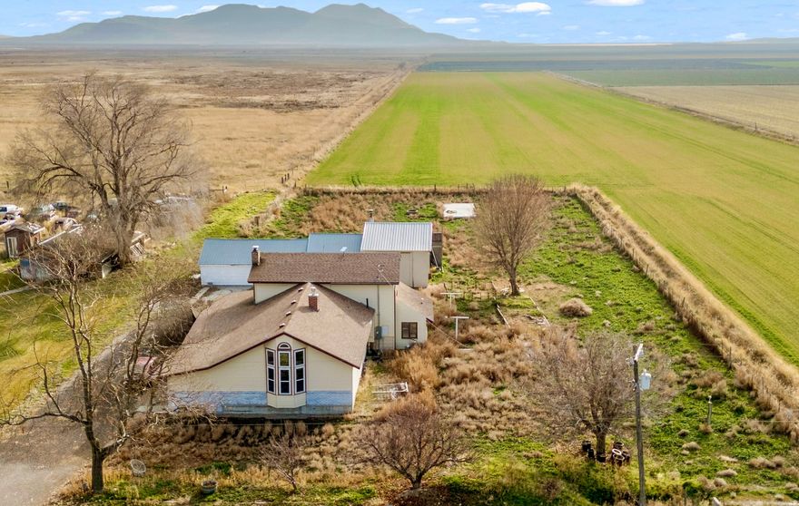 SELLER IS OFFERING $4,500 toward CLOSING COSTS when you use our preferred lender ***.***   UPDATED HORSE PROPERTY  COUNTRY LIVING at Its Best!!  This beautiful home went through extensive UPDATES in 2021, with NEW INTERIOR PAINT, most of the main floor REMODELED, and UPDATED ELECTRICAL.  With nearly 3,500 sq.ft. on a FULL 1-ACRE LOT, there's plenty of room to relax and recharge, enjoy gorgeous MOUNTAIN VIEWS, plus space for Horses, a Cow, or Chickens - perfect for those who value SPACE, FREEDOM, and a refined COUNTRY LIFESTYLE.  Tucked away in Tremonton's peaceful countryside, this beauty offers wide-open VIEWS, PRIVACY, and QUIET SERENITY, while still providing QUICK ACCESS to I-15 and I-84 for effortless travel to Brigham City, Ogden, or Idaho.  It's the perfect balance of RURAL LUXURY and EVERYDAY CONVENIENCE.  This is the home you've been looking for - come see it today!  Information and measurements are provided as a courtesy. Some photos are virtually staged. Buyer is advised to obtain their own measurements and verify all information.  Please contact the listing agent Daniel Talbert at 385-229-2557 to schedule a showing