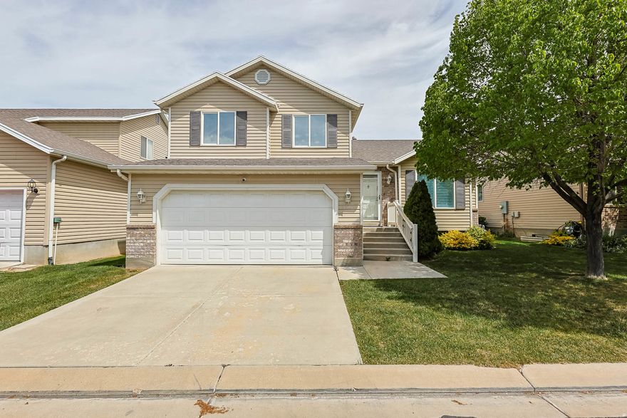 Welcome to this cozy home with a luxury kitchen! Nestled in the heart of Stansbury this adorable home is such a show stopper! Offering a gorgeously updated chefs kitchen, you will be in heaven preparing dinner each evening. This stunning kitchen renovation was completed in 2021 & thoughtfully expanded the space to create a one-of-a-kind kitchen, perfect for entertaining. They went all out with custom cabinetry, some internally lit open cabinet spaces, custom lighting, granite countertops, luxury vinyl plank (LVP) flooring, custom railing, and elegant plantation shutters. Enjoy top-of-the-line LG stainless steel appliances and an oversized island that serves as the ideal gathering place for cooking and hosting. Both Bathrooms were updated in 2021 as well. This property has the feel of home without the yard work and high maintenance. Enjoy your own private fenced area along with a shared, maintained grass area. This home is a great price for the beautiful features it offers and has a basement you can finish to your liking to add common areas and/or bedrooms. Minutes away from I-36 to head to Tooele or Salt Lake ensuring commute time is ideal! This is a must see in person!