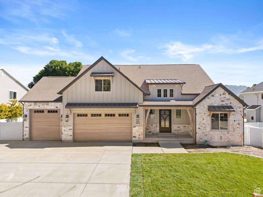 This 4-bedroom, 3.5-bath home offers over 5,500+SqFt of thoughtfully designed living space in a quiet, picturesque neighborhood. From the custom front door to the open-concept main level, every detail blends craftsmanship with comfort. The heart of the home is the gourmet kitchen, featuring custom cabinetry, detailed trim work, and built-ins surrounding the fireplace. The spacious living area is perfect for gatherings or quiet evenings at home. A generous primary suite brings in abundant natural light, while the laundry and craft room add convenience to everyday living.  The unfinished basement with its own entrance provides endless possibilities-whether for additional bedrooms, a theater, or a game room. Outside, enjoy a landscaped yard with a west-facing patio ideal for shaded summer evenings. The RV pad offers extra space for parking and storage.  Located minutes from I-15, Costco, parks, and shopping, this home balances tranquility with easy access to everyday essentials.  Experience a home designed for both style and function-schedule your showing today.
