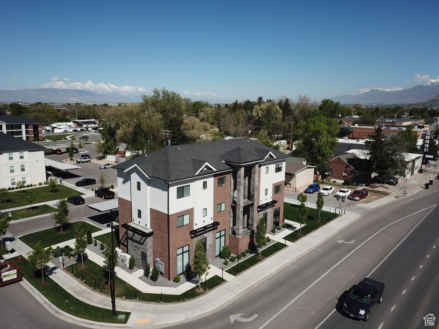 Beautiful new and very functional building in a new project in Springville.  2 offices on the main level and 4 apartments above.  All apartments are rented and both offices have great tenants.   Offices have kitchens and bathrooms and 14 foot ceilings. Long term tenant in one and the owner has a 5 year lease.  Turnkey property.