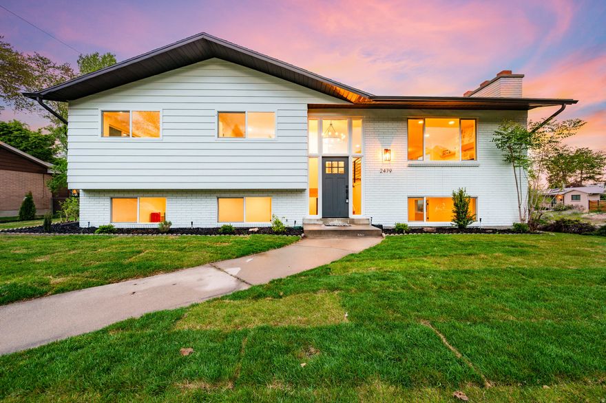 Opportunities like this don't come around very often! You'll fall in love with this rare home that features an expansive open floor plan, highlighted by an oversized addition that serves as a grand family room-perfect for entertaining or relaxing in style. What truly sets this property apart is the abundance of windows on three sides of the family room, capturing breathtaking, unobstructed views of downtown Salt Lake City and the Wasatch Mountains while filling the space with natural light. The fully remodeled kitchen and all four bathrooms showcase elegant quartz countertops, brand-new custom cabinetry and stainless steel appliances. All new modern plumbing fixtures and lighting.  Most areas of this home have been upgraded, including fresh wall texture and paint throughout, new doors, casing, and base molding,  plumbing and electrical finishes, a stunning rock fireplace as a central focal point, all new windows for efficiency and style, and newly completed landscaping that provides clean, move-in-ready curb appeal. This is not your typical remodel-it is a complete transformation with thoughtful design, quality finishes, and truly unmatched views.