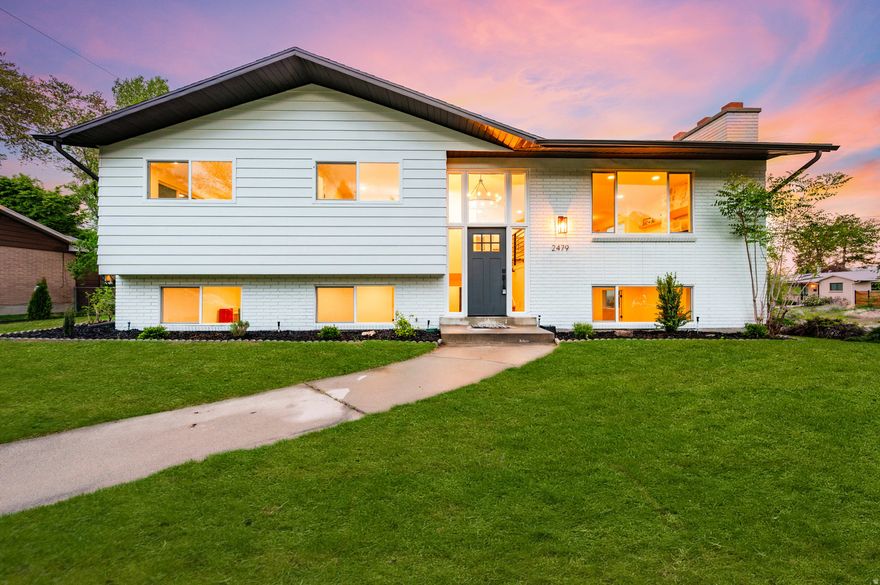 Opportunities like this don't come around very often! You'll fall in love with this rare home that features an expansive open floor plan, highlighted by an oversized addition that serves as a grand family room-perfect for entertaining or relaxing in style. What truly sets this property apart is the abundance of windows on three sides of the family room, capturing breathtaking, unobstructed views of downtown Salt Lake City and the Wasatch Mountains while filling the space with natural light. The fully remodeled kitchen and all four bathrooms showcase elegant quartz countertops, brand-new custom cabinetry and stainless steel appliances. All new modern plumbing fixtures and lighting.  Most areas of this home have been upgraded, including fresh wall texture and paint throughout, new doors, casing, and base molding,  plumbing and electrical finishes, a stunning rock fireplace as a central focal point, all new windows for efficiency and style, and newly completed landscaping that provides clean, move-in-ready curb appeal. This is not your typical remodel-it is a complete transformation with thoughtful design, quality finishes, and truly unmatched views.