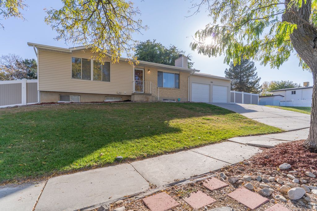 Photo of 1451 W BLUEMONT DR S, Taylorsville, UT 84123 (MLS # 2124789)