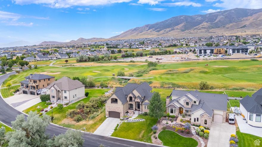 Relax and take in the incredible views! Lakefront living at its best! Talon's Cove Golf Course as a backyard neighbor? Utah Lake as a front yard neighbor? Yes, please! Take advantage of this top-tier community along the shoreline of Utah Lake. Take a stroll along the lakeside paths, soak in the hot springs swimming pool, take the boat to the private marina, or host an event at the clubhouse. When you enter this home, you will be stunned by the incredibly tall great room with wood framed windows and fireplace! The entire home feels like luxury. New roof, new double ovens, new high-quality LVP flooring, new paint, new lighting and more... enjoy the NEW feeling of this beautiful home! The expansive primary suite claims the entire north end of the main level, providing a quiet sanctuary with plenty of storage, its own washer and dryer, and even has its own covered private patio! The upper level has 3 bedrooms, a full bathroom, and a large bonus room that can easily be converted into 4th bedroom. Two of the upstairs rooms have balconies to showcase the lake views. The basement has 2 bedrooms that are in the process of being fully finished. They are already framed & drywalled in, just needing a few details to be done on trim and flooring. Come take a tour!