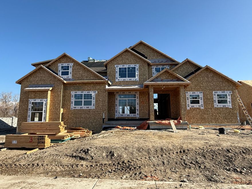 Rarely do you find a brand-new estate on a half-acre in the heart of Lehi. Currently at the sheetrock stage, this 2-story residence by Sweetwater Homes offers a unique opportunity to secure a high-end property before the spring rush. This isn't a "cookie-cutter" build; it is a custom-caliber home designed for those who value space, privacy, and intentional design.  House selections by Alika Design. Forget the stress of picking finishes. The entire interior and exterior has been curated by the Alika Design team. Expect a cohesive, modern aesthetic where every quartz surface, custom light fixture, and tile choice works in harmony to create a sophisticated yet "homey" environment.  The Culinary Hub The kitchen is the center of gravity in this home.  Scale & Service: A massive gathering island is complemented by a professional-grade, double-wide fridge/freezer and premium quartz tops.  The "Hidden" Factor: A true walk-in hidden pantry keeps the main kitchen spotless while providing a second space for storage.  Precision: Custom soft-and-slow close cabinetry throughout-a hallmark of Sweetwater quality.  Main Floor Luxury & Living  The Master Wing: Secluded on the main floor, the master suite is a true retreat. It features a spa-inspired bath with a freestanding soaking tub, a large walk-in shower, and the rare luxury of his-and-hers walk-in closets.  Upper Level Loft: Upstairs, the floor plan opens into a sprawling loft-the perfect buffer between the bedrooms and an ideal space for a secondary family room.  The Garage: A 3-car attached garage ensures plenty of room for vehicles, gear, and storage.  The Grounds The half-acre lot is a blank canvas. Whether you envision a detached shop, a swimming pool, or a private backyard oasis, the 0.46 acre footprint provides the rare freedom to build it.  Specs at a Glance:  Bed/Bath: 4 Bedrooms | 2.5 Bathrooms  Dimensions: 3,090 Finished SQFT | 5,169 Total SQFT  Basement: 2,079 SQFT (Unfinished - ready for your future theater or gym)  Status: Sheetrock Stage (Estimated completion: April 2026)