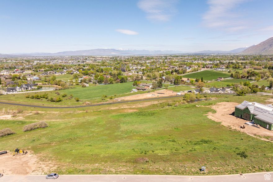 This is one of the premiere lots in Utah County. It is in the Preserve in Mapleton, and at 4.5 acres it is also one of the largest lots in the development. It is a downhill build perfect for a walkout basement. The views are spectacular and the best part is they will never be blocked.  In one window you will be able to watch the sun set over Utah Lake and in another you can gaze out at the beautiful mountain views.  It's an ideal setting. The lot is ready to be built on.  The Preserve is located on the foothills of Maple Mountain and with large lots and incredible views this development is unmatched anywhere in Utah County.
