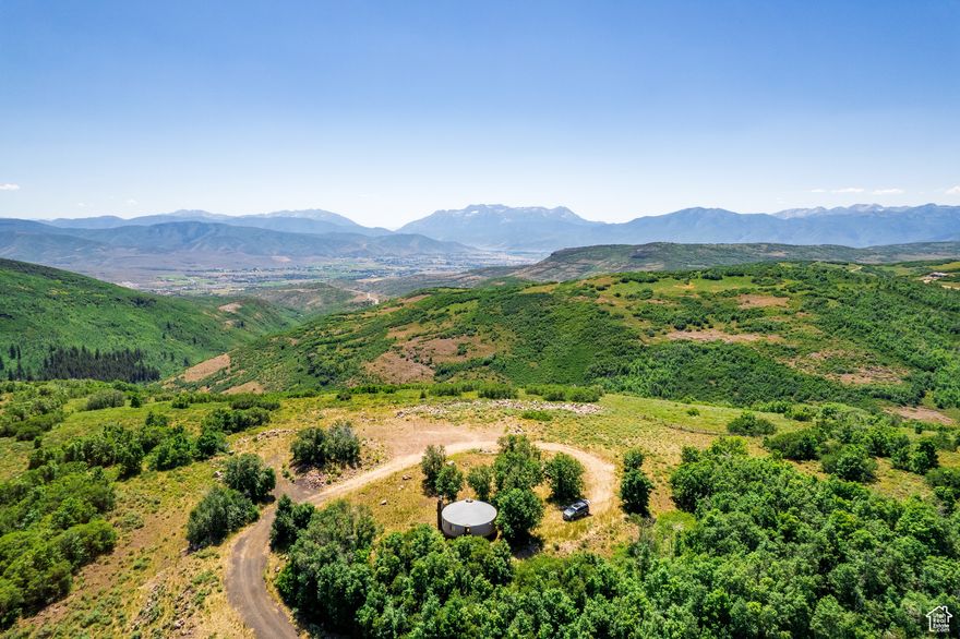 Escape to The Forest Creek Yurt. Your private weekend sanctuary where mountain dreams take root. The only property available with a luxurious yurt already in place, perfectly positioned for breathtaking views of Mt. Timpanogos, the Heber Valley, and Deer Creek Reservoir.    Enjoy the ultimate glamping retreat with a full kitchen, wood-burning stove, bedroom, loft, and bath - everything you need for effortless weekends in nature. Spend time here, and you'll quickly fall in love with the quiet beauty and unmatched lifestyle of Wolf Creek Ranch.  With the driveway and all utilities already installed, you'll be ready when it's time to build your main home, guesthouse, and barn (three structures allowed per lot).   Set on 14,000 private acres with 60 miles of trails, private trout ponds, the Provo River, and equestrian facilities, Wolf Creek Ranch offers adventure by day and serenity by night - the perfect place to build your legacy.