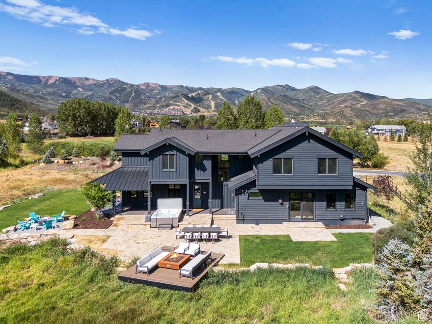 Set on a quiet cul-de-sac in the heart of Park City's coveted Old Ranch Road neighborhood, this modern alpine retreat is one of the only fully modernized estates on more than two acres within the Park City School District. Surrounded by acres of open space and wetlands, the property delivers rare privacy and forever views that sweep from wildlife-filled meadows to the Wasatch Range and across to the Canyons at Park City Mountain Resort.  Reimagined in 2024, every space was tailored for today's mountain lifestyle. The foyer opens to expansive living areas where walls of glass dissolve into the landscape. At the center, a chef's kitchen with Wolf appliances and a discreet induction island anchors the dining and great room, flowing seamlessly to a patio designed for year-round entertaining, from aprs-ski evenings by the fire to starlit summer gatherings.  Upstairs, a great room with an elongated fireplace and custom kitchenette creates a retreat for family and guests, complemented by three uniquely styled bedrooms. A private wing holds the primary suite with panoramic mountain vistas, a spa bath with soaking tub and advanced steam shower, and a boutique-style closet with natural light and a center island.  Designer lighting, curated finishes, and statement textures elevate the home throughout. Preliminary plans envision nearly doubling the square footage with a vaulted great room and additional walls of glass that frame both wetlands and ski slope vistas.  This estate is more than a residence. It is a rare vision of Park City living, peaceful, private, and sophisticated, just a stone's throw from the Canyons, five minutes to Main Street, and five minutes to Kimball Junction.