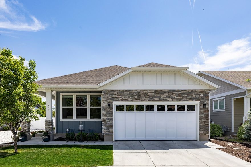 GREAT LIGHT, 4,100 SQ. FT., AND BUILT IN 2020 - all in the heart of Sugar House. Opportunities to find this combination of space, natural light, modern finishes, and newer construction at this price point are rare. This custom 5-bedroom, 6-bath rambler is ideally situated along charming Hopkins Lane in the desirable Sugarhouse Place subdivision. The thoughtfully designed main level welcomes you with soaring vaulted ceilings and dramatic floor-to-ceiling windows that fill the home with natural light. An open-concept floor plan seamlessly connects the kitchen, dining, and family areas, creating the perfect setting for entertaining and everyday living. The inviting great room features a cozy gas fireplace and stunning views of Mt. Olympus. The beautifully appointed kitchen offers quartz countertops, custom cabinetry, a large island with seating for four, gas range with hood, built-in pantry, and exceptional gathering space for cooking, conversation, and family activities. Sliding glass doors open to an outdoor living area ideal for relaxing or entertaining. The main level also includes two bedrooms, highlighted by a luxurious primary suite with its own gas fireplace, dual vanities, soaking tub, and Euro glass shower. A secondary en suite bedroom provides comfort and privacy for guests or family members. The mudroom/laundry area is both functional and stylish, featuring custom storage lockers, tile flooring, laundry sink, and a convenient powder bath. Beautiful hardwood floors, modern railing details, and light-filled spaces complete the main floor. The fully finished lower level is equally impressive, featuring 9-foot ceilings, a spacious family room with gas fireplace, and three additional en suite bedrooms offering flexibility for family and guests alike. A large workout room and generous storage space add to the home's functionality. Located just minutes from Sugar House Park, shopping, dining, and freeway access, this exceptional home combines modern luxury, generous living space, and peaceful neighborhood living in one of Salt Lake City's most desirable communities.