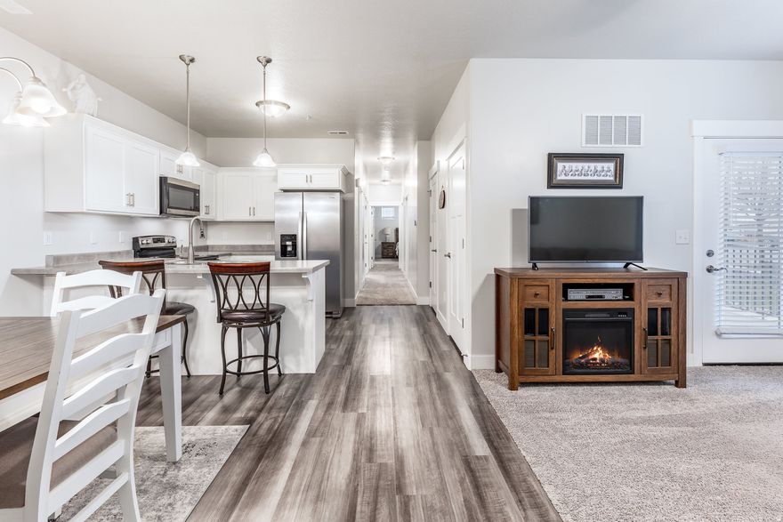 Enjoy this immaculate main floor condominium with your garage attached and the ease of no steps. With everything from hospitals to grocery stores and restaurants to shops minutes away, you will love this location. Experience all the many amenities the HOA has to offer including a pool, pickleball courts, gyms, basketball courts, and many green spaces to play and relax. You can even reserve the spacious clubhouse for a private event. You will be amazed at how energy efficient this home is being on the main floor. Come see your future home and experience how great it can be.