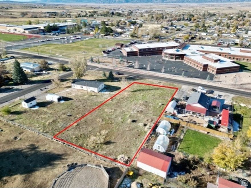 Prime .44-Acre Lot within City Limits! Build your dream home on this spacious and relatively flat .44-acre lot, ideally located just steps from both the elementary and high school. Enjoy the convenience of in-town living with the added bonus of beautiful mountain views. With utilities nearby and ready-to-build potential, this property offers the perfect blend of location, space, and scenic surroundings. Don't miss this rare opportunity! Pressurized Irrigation is stubbed on the lot.  All information within is provided as a courtesy only. Buyer and Buyer's agent advised to complete their own due diligence. Property and lot lines are shown as approximate.
