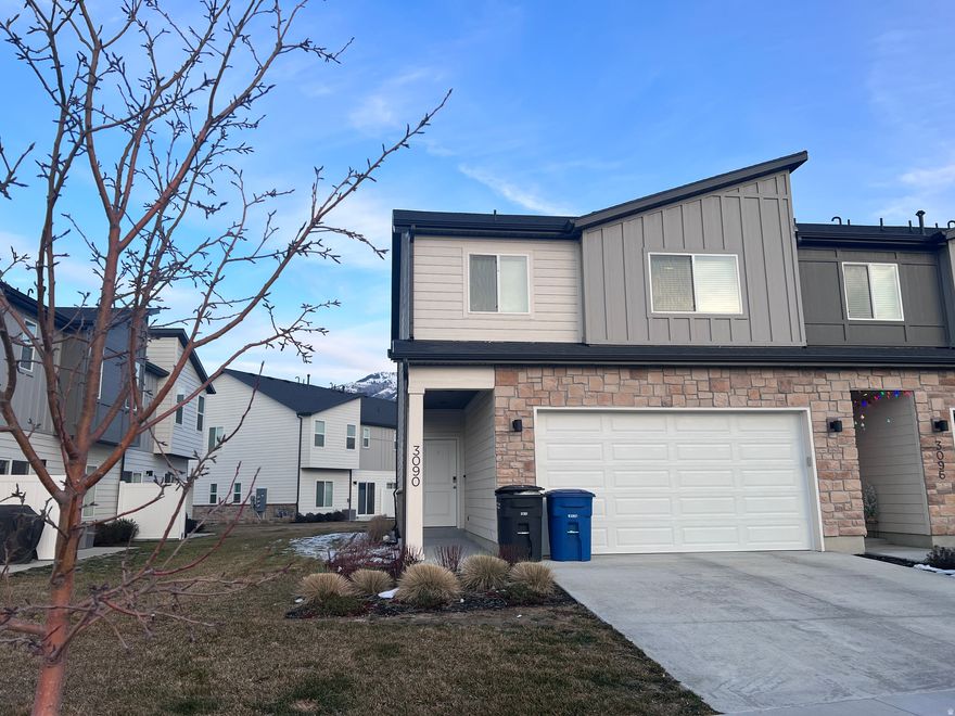 Welcome home to this nearly new corner-unit townhome, built in 2022 and ideally located in the heart of Nibley. With added privacy, extra natural light, and a highly desirable setting, this home checks all the boxes.  The thoughtfully designed floor plan offers 3 spacious bedrooms and 2 bathrooms, including a stunning primary suite featuring a large walk-in closet and a private en-suite bathroom. The open living areas are bright and inviting, perfect for everyday living or entertaining.  Enjoy the peace of a newer build without the wait, all in a sought-after neighborhood close to parks, schools, and local amenities. Clean, modern, and move-in ready, this is one you won't want to miss.