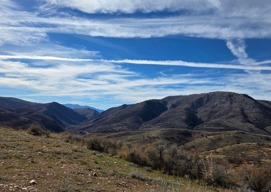 Escape to your private mountain top sanctuary on a 4.5-acre parcel perched on the back side of the Wasatch Front in Evergreen, Huntsville. Rolling terrain reveals dramatic, unobstructed views across the valley to the surrounding peaks. Seasonal access preserves a peaceful, off-grid vibe-perfect for a summer cabin, weekend basecamp, hunting retreat or a self-sufficient spot year after year. A perfect canvas for the mountain lifestyle you've imagined.  Large pad to take in the views!  Roads are not paved or maintained in this area. Cell coverage is spotty. Build the retreat you've envisioned: add your well and septic to suit your layout. If you're seeking more space, additional land is available. TAX ID: 23-024-0018 Offered at $27,000 for 2.5 acres. Combined sale offered at $99,400. Google map the lot location before you go. (travel 2.5 miles up Evergreen Park Dr take left on High Pine then make your way down to the lot.) Sign on property. Allow 48 hours notice to respond to offer.