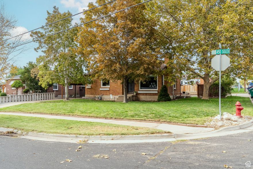 Welcome to this adorable and well-maintained all-brick rambler, perfectly situated on a spacious corner lot. This fully finished home features 3 bedrooms and 2 bathrooms, offering a cozy yet functional layout. The home features updated flooring and new paint, giving the home a fresh, modern feel while maintaining its classic charm. The bright and inviting living spaces make it easy to feel right at home. Outside, you'll find a detached garage-perfect for parking, storage, or even a workshop setup. The corner lot provides extra space and curb appeal, with room to enjoy the outdoors. Conveniently located near shopping, dining, and with quick access to I-15, this move-in-ready gem checks all the boxes for comfort, convenience, and charm.