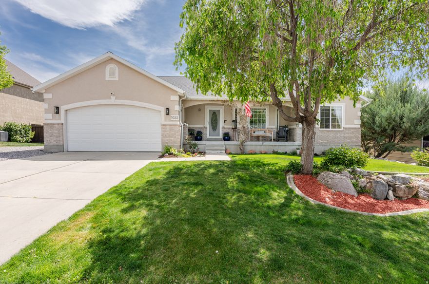 Beautiful east bench rambler in Pleasant Grove offering flexible living with separate lower level that has a proven track record of Airbnb and rental income. Located in a quiet, established neighborhood with quick access to Provo Canyon, hiking, biking, and nearby ski resorts, this home combines lifestyle, location, & opportunity. Main level features an open layout, abundant natural light, a welcoming kitchen w/stainless steel appliances & comfortable living spaces. Primary suite includes a private bath, w/additional bedrooms providing flexibility for guests, office, or family needs. The kitchen appliances-including the refrigerator, stove, and dishwasher-have all been replaced within the past two years, and the roof is also just two years old. The fully finished walkout basement includes a separate entrance & a full second kitchen w/updated cabinetry, creating an ideal setup for a mother-in-law apartment, Airbnb, or rental income opportunity. This lower level has been successfully utilized for short term rental use, offering privacy & separation from the main living space. Income documentation available upon request. Furnishings in the lower level Airbnb space are negotiable. The downstairs rental unit has its own dedicated parking area on the side of the home. Outdoor living is a standout feature with mature landscaping, terraced garden beds, & a beautifully designed pergola covered dining area perfect for entertaining. The private backyard offers a peaceful retreat with space to relax, garden, and gather. Additional features include a 2 car garage, ample parking, and a well maintained lot in a highly desirable east bench location. Square footage figures are provided as a courtesy estimate. Buyer to verify all.
