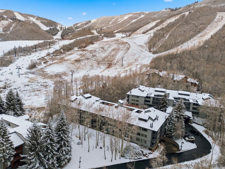 Unit 110 at Snow Flower isn't just ski-in/ski-out on paper. It's the unit where you clip in, take a few steps, and you're gone. No stairs. No elevators. No long hallways. Just walk out your patio and straight to the lifts at Park City Mountain Village.  This ground-level, 2-bedroom, 2-bath condo sits in one of the most sought-after positions in the community, closest to the ski path with a true walk-out patio. Morning coffee in the snow. Aprs straight from the slopes. Easy in, easy out, every single day.  Inside, the home is warm, comfortable, and well maintained, offering a classic mountain feel that fits the setting perfectly. It's move-in ready as-is, with a layout and finishes that have held up beautifully over time, and room for a future owner to tailor it to their own style if desired.  Snow Flower is one of Park City's most established nightly rental communities, and units in this position consistently attract strong demand. The combination of true ski access, walk-out convenience, and a 2-bedroom layout makes this condo easy to use personally and easy to rent when you're not here.  For buyers thinking longer-term, there's also a unique opportunity to expand within the community. Additional units are available, allowing an owner to build a larger ski-in/ski-out presence over time, something that's becoming increasingly difficult to do in Park City.  Whether this is a place you keep for yourself, rent when it makes sense, or hold as a long-term asset in an irreplaceable location, Unit 110 checks boxes that are hard to replicate and even harder to replace.