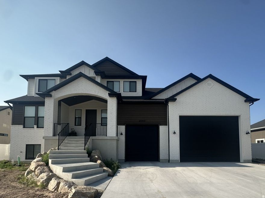 Don't miss the rare opportunity to own a like-new, move-in ready, Castle Creek custom home without the wait of building.  Plus, the opportunity to create your own outdoor oasis in an almost fully fenced yard, combined with a large covered deck. Enjoy modern living in this home built in 2025 on a 0.25-acre lot with 3,835 square feet, 6-bedrooms, 3.5-bathrooms and a finished, walk-out basement.  In a wonderful location with easy access to shopping, entertainment and the new Davis Corridor.   The exterior features Hardie Board and brick, complemented by an impressive 8-foot front door. Inside, you'll find custom cabinetry, designer tile, and a fireplace. The layout includes two spacious family rooms, a dedicated office, and a convenient mudroom. The kitchen is built for both everyday living and entertaining, featuring double wall ovens, six-burner gas range top and an expansive pantry.  The primary suite is complete with a large sitting room, walk-in closet and a master ensuite featuring a walk-in shower with dual shower heads.  The fully finished, daylight basement includes 9-foot ceilings and a kitchenette with walk-out basement access into the oversized three-car garage, with RV parking capabilities. Upstairs and down, comfort is enhanced by a 2-zone HVAC system, water softener, and two 40-gallon water heaters. This home combines space, style, and versatility-ready to meet all your needs.  Buyer and Buyer's Agent to verify all. Sq ft and all information is provided as a courtesy. EARNEST MONEY to be deposited in a Real Estate Brokerage Trust account NOT with a title company.