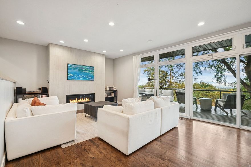Tucked into one of Salt Lake City's most desirable east-side foothills neighborhoods, this fully remodeled 1957 rambler delivers effortless main-level living with the views to match. The open great room flows to a covered patio and secluded backyard where the Wasatch and valley panoramas take center stage - morning or evening, it never gets old.  The thoughtfully updated interior features hardwood floors, a primary suite with walk-in closet and separate tub/shower, and a fully finished walkout basement with a second kitchen and mother-in-law apartment - ideal for multi-generational living or rental income.  A fully landscaped, fenced yard with mature trees, smart thermostat, attached garage, and quick freeway access round out a home that checks every box.