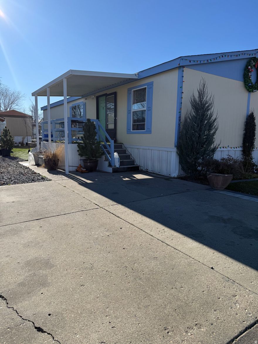 Built in 2006, this very well maintained mobile home features fresh exterior paint (10/2025), a full sprinkler system with drip irrigation, a newly replaced exterior skirt, and recently replaced laminate flooring in two of the bedrooms.  The landscaped outdoor area  Includes a basketball hoop, storage shed, and plenty of space to spend time outside.  The convenient park location presents a great opportunity for comfortable, low-maintenance living in the heart of West Jordan.  Square footage figures are provided as a courtesy estimate only and were obtained from MLS.  Buyer is advised to obtain an independent measurement.