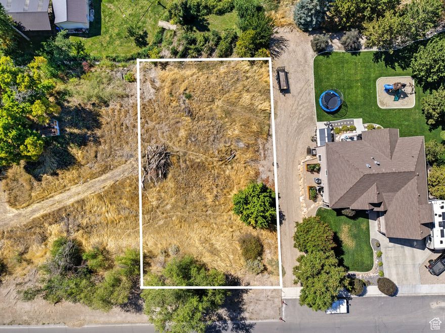 Great opportunity to build in the heart of Payson. This .24 acre parcel (55:959:0003) is part of a small development where curb, gutter, and all utilities will be stubbed and available. Development is currently underway and scheduled to be completed before November.  The location is ideal with quick access to I-15, Mountain View Hospital, and all the amenities of downtown Payson. Whether you're a builder looking for your next project or a buyer wanting to design your own home, this lot offers excellent potential in a prime spot.